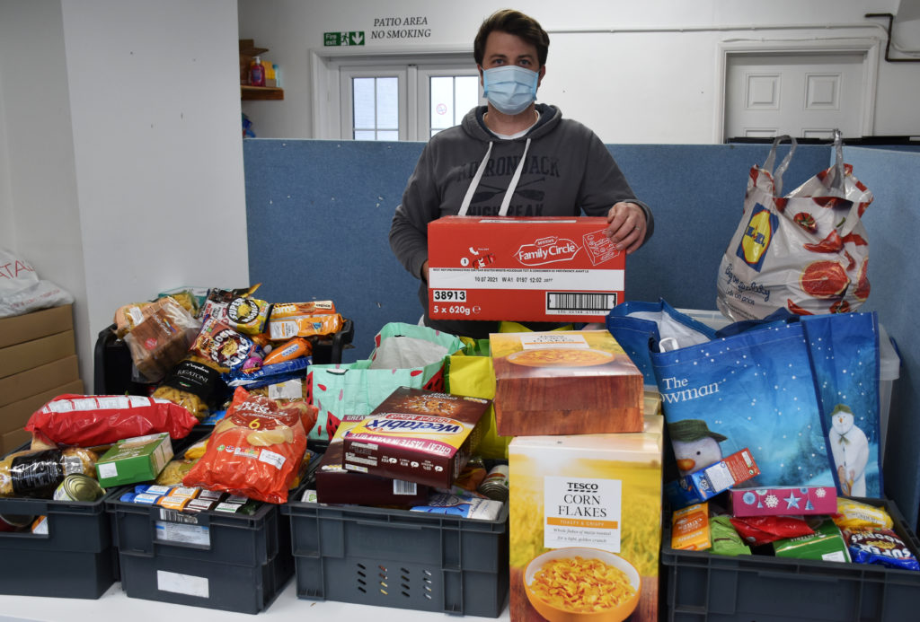 Sam Porter, Operations Manager for Lowestoft Foodbank, with the donation. Photo East Coast College.