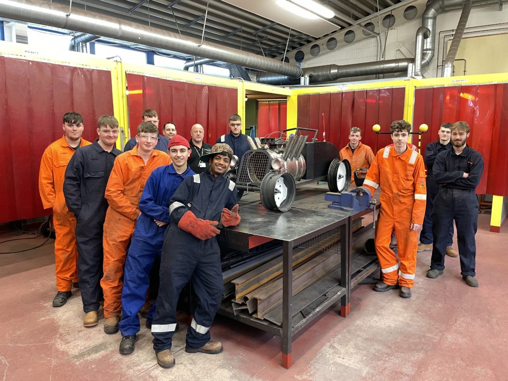 Welding students at East Coast College with their log burner. Photo East Coast College. 