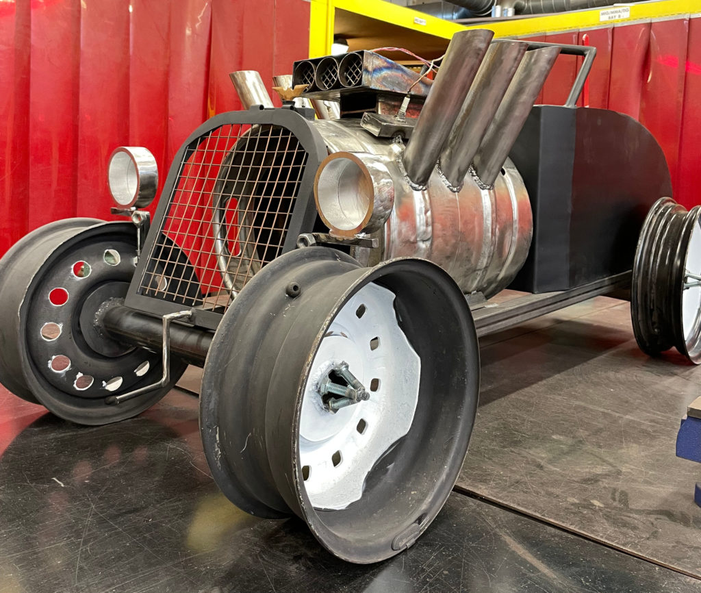 The car themed log burner built by Welding students. Photo East Coast College.