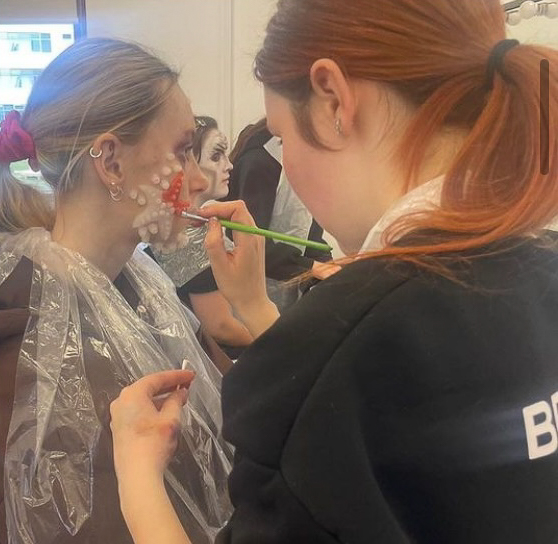 East Coast College Level 4 media make-up student applying special effects make-up to a client